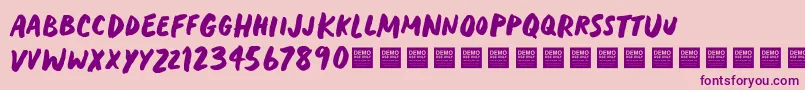 フォントHeavyTripDemo – ピンクの背景に紫のフォント