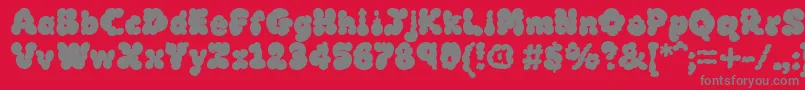 フォントMcklb – 赤い背景に灰色の文字