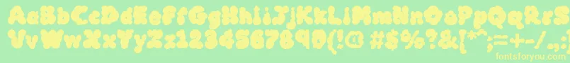 フォントMcklb – 黄色の文字が緑の背景にあります