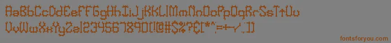 Nymonak Font – Brown Fonts on Gray Background