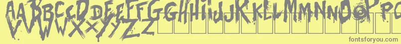 フォントBatesShower – 黄色の背景に灰色の文字