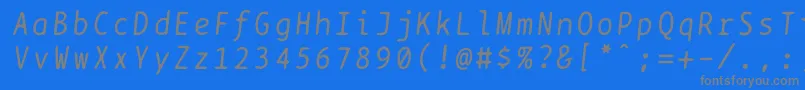 フォントBptypewriteitalics – 青い背景に灰色の文字