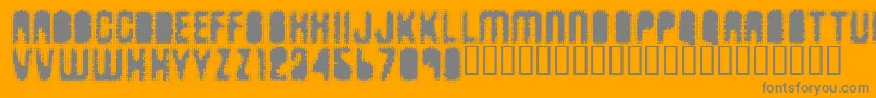 Fonte Antkille – fontes cinzas em um fundo laranja