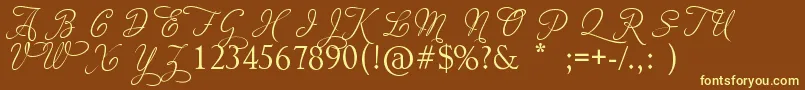 AdiosScriptCapsIii-fontti – keltaiset fontit ruskealla taustalla