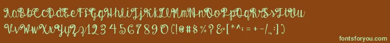フォントAustieBostEnvelopes – 緑色の文字が茶色の背景にあります。