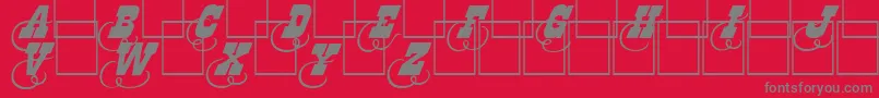フォントDodgeini – 赤い背景に灰色の文字