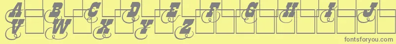 フォントDodgeini – 黄色の背景に灰色の文字