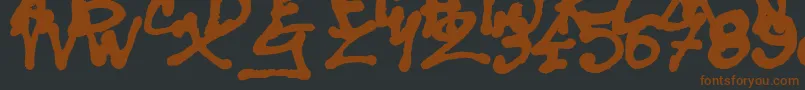 SisterSpray-fontti – ruskeat fontit mustalla taustalla