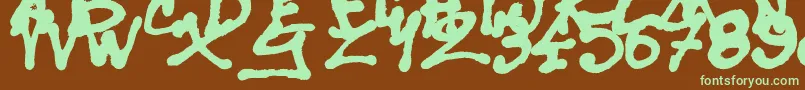 SisterSpray-fontti – vihreät fontit ruskealla taustalla