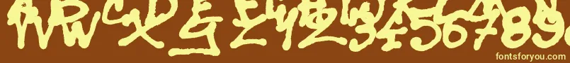 SisterSpray-fontti – keltaiset fontit ruskealla taustalla