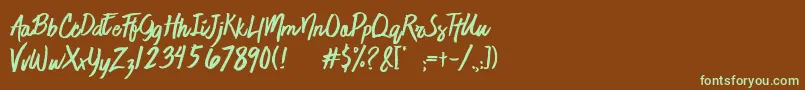 フォントJaimeBlues – 緑色の文字が茶色の背景にあります。