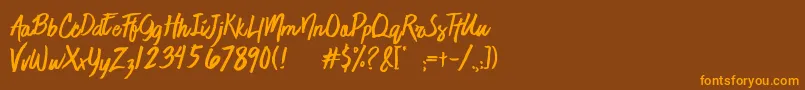 フォントJaimeBlues – オレンジ色の文字が茶色の背景にあります。