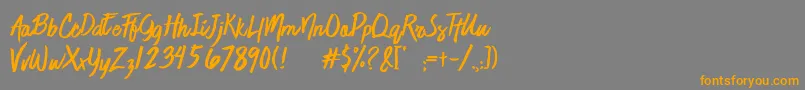 フォントJaimeBlues – オレンジの文字は灰色の背景にあります。