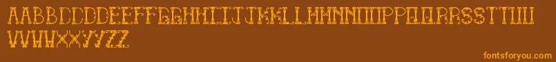 フォントLimitless – オレンジ色の文字が茶色の背景にあります。