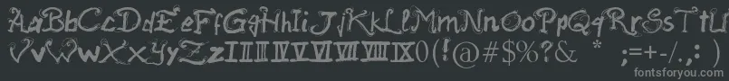 RaslaniAncientScript-fontti – harmaat kirjasimet mustalla taustalla