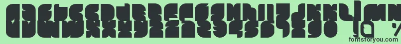 フォントTasious – 緑の背景に黒い文字