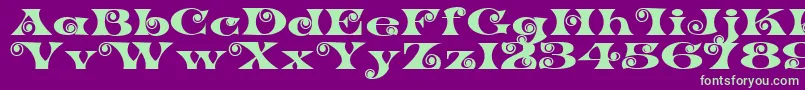 K22SpiralSwash Font – Green Fonts on Purple Background