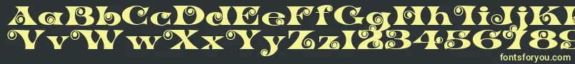 K22SpiralSwash Font – Yellow Fonts on Black Background