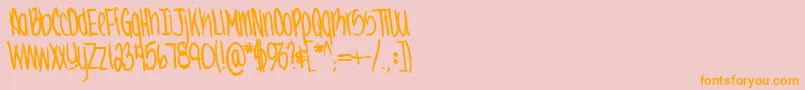 フォントJennabold – オレンジの文字がピンクの背景にあります。