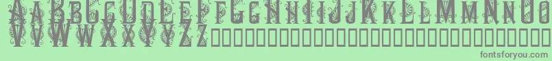 Decocaps Font – Gray Fonts on Green Background