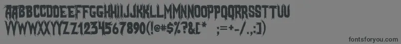 フォントMostlyGhostly – 黒い文字の灰色の背景