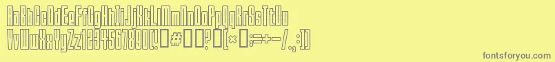 Squeezemebaby-fontti – harmaat kirjasimet keltaisella taustalla