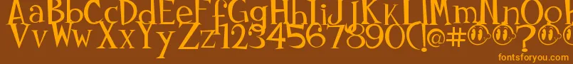 フォントJohnyokonysm – オレンジ色の文字が茶色の背景にあります。