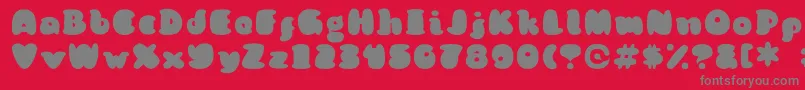 フォントKongquestRegular – 赤い背景に灰色の文字