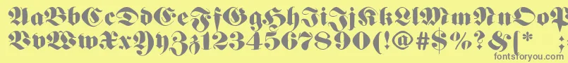 Germanfatman-fontti – harmaat kirjasimet keltaisella taustalla