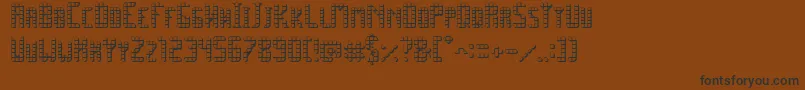 フォントSpacePez3D – 黒い文字が茶色の背景にあります