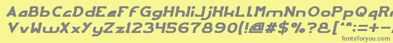 ArcadeItalic-Schriftart – Graue Schriften auf gelbem Hintergrund