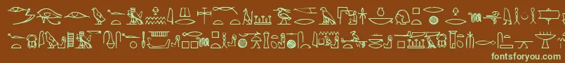 フォントYiroglyphics – 緑色の文字が茶色の背景にあります。