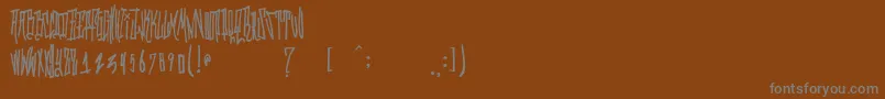 GrafitikRiot Font – Gray Fonts on Brown Background