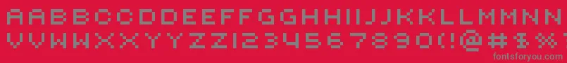 フォントRotorcapExtended – 赤い背景に灰色の文字