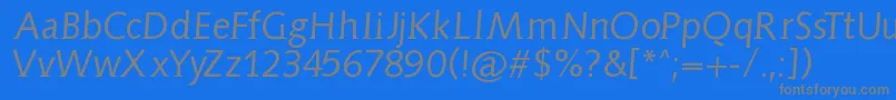 Aidaserifobliquemedium-fontti – harmaat kirjasimet sinisellä taustalla