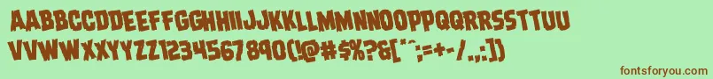 フォントDreadringerrotate – 緑の背景に茶色のフォント