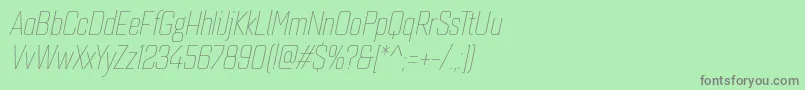 フォントQuarcacondthinitalic – 緑の背景に灰色の文字