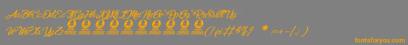 MelancholightItalic-Schriftart – Orangefarbene Schriften auf grauem Hintergrund