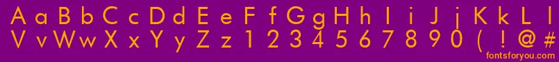 FuturistfixedwidthRegular Font – Orange Fonts on Purple Background