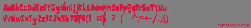 フォントKkSchnitzler – 赤い文字の灰色の背景