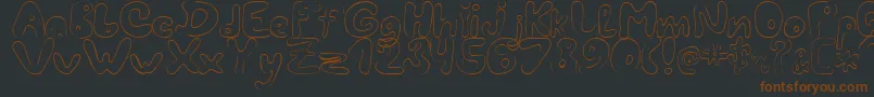 LcBlowzy-fontti – ruskeat fontit mustalla taustalla