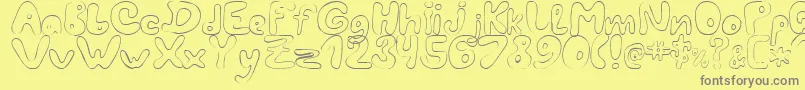 LcBlowzy-fontti – harmaat kirjasimet keltaisella taustalla