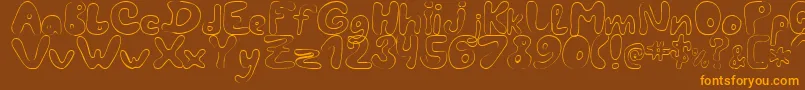 フォントLcBlowzy – オレンジ色の文字が茶色の背景にあります。