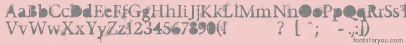 Undecapped-fontti – harmaat kirjasimet vaaleanpunaisella taustalla