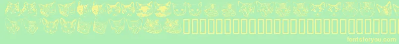 Kittyprint Font – Yellow Fonts on Green Background