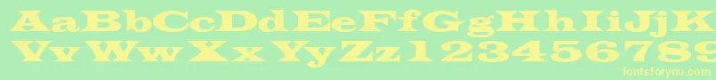 フォントTransversessk – 黄色の文字が緑の背景にあります