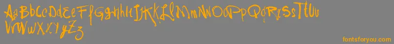 フォントVtksRash – オレンジの文字は灰色の背景にあります。