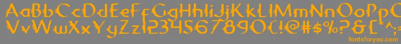 フォントGypsyroad – オレンジの文字は灰色の背景にあります。