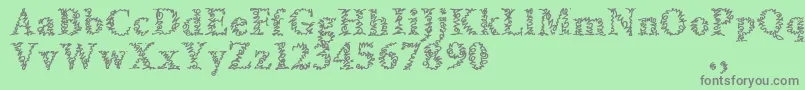 フォントAmltrial – 緑の背景に灰色の文字