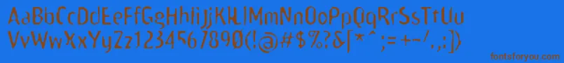 フォントScamofobiarainc – 茶色の文字が青い背景にあります。